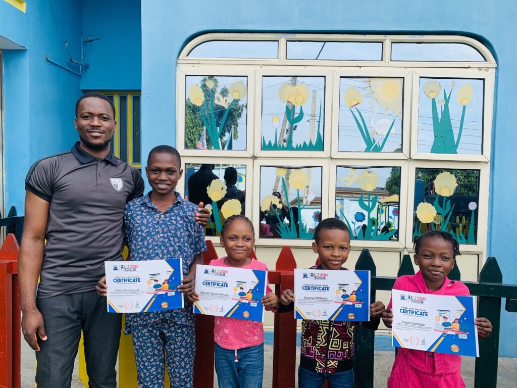 kidz tech coding club summer bootcamp participants show casing their certificate.